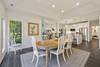 Dining room table seating for 8, plus 3 more at kitchen bar counter.