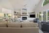Living room with sectional seating and lots of natural light