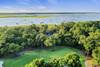 Aerial View of Neighborhood, Nearby Marshes, and Cougar Point Golf Course
