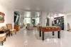 Game room with TV, wet bar, ping pong tabke, foosball and bathroom