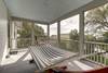 Second floor screened in porch with hammock