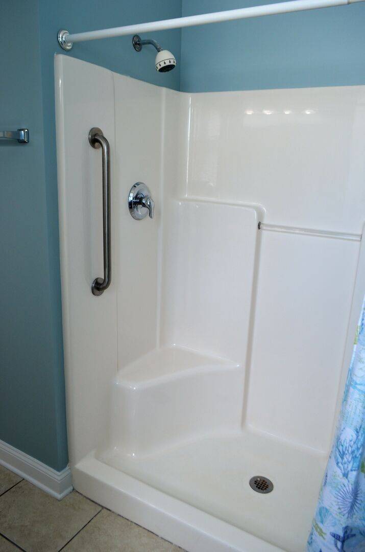 has a walk-in shower with built-in seat has a walk-in shower with built-in seat