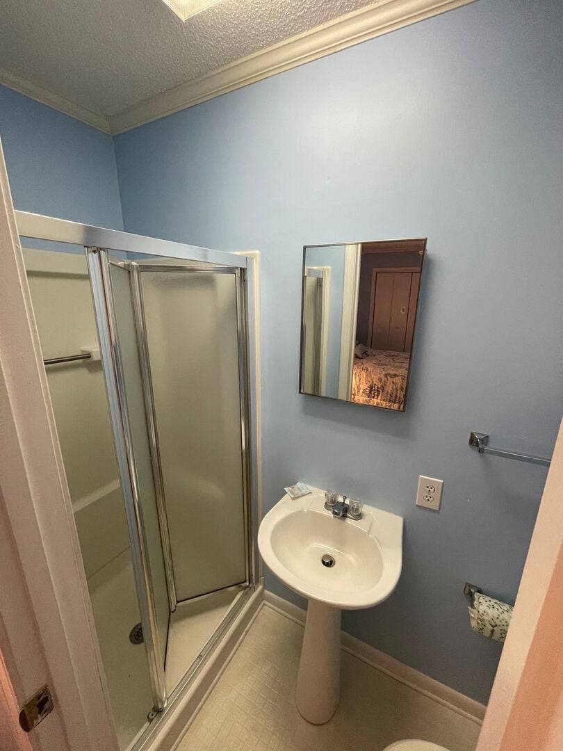 a walk-in shower. a walk-in shower.
