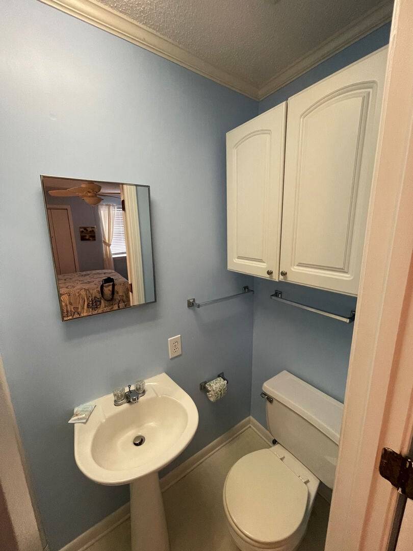 Bedroom 2 bath with a pedestal sink and Bedroom 2 bath with a pedestal sink and