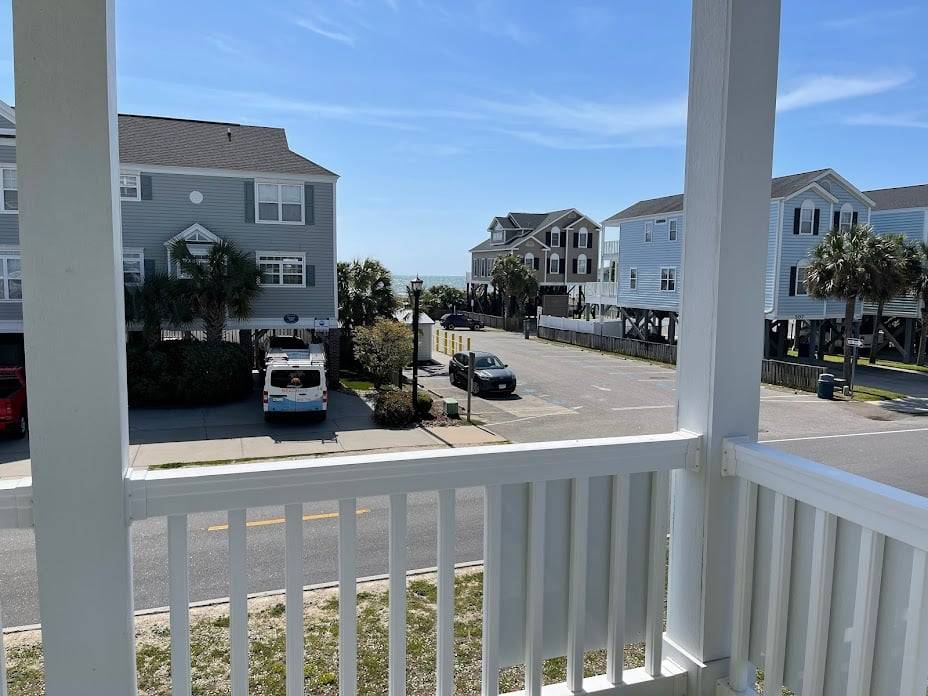 View of beach access and ocean from covered porch View of beach access and ocean from covered porch