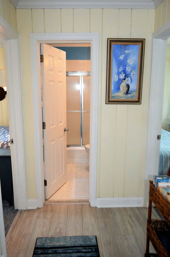 Cottage 1: Hall Bathroom (remodel in progress Fall 2023) Will be a walk-in shower and no longer have a tub. New photos coming soon. Cottage 1: Hall Bathroom (remodel in progress Fall 2023) Will be a walk-in shower and no longer have a tub. New photos coming soon.