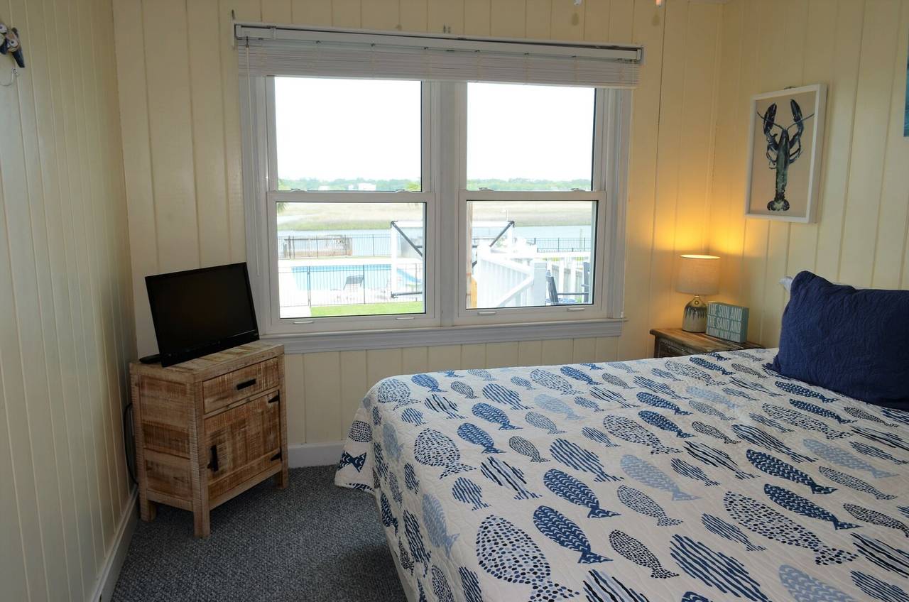 Cottage 1: Bedroom 3 with Flat Screen TV & Marsh Views Cottage 1: Bedroom 3 with Flat Screen TV & Marsh Views