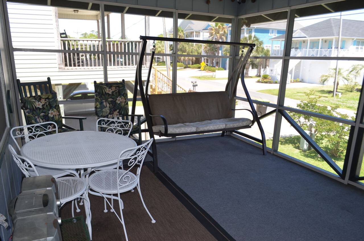 Screened porch with lots of seating. Screened porch with lots of seating.