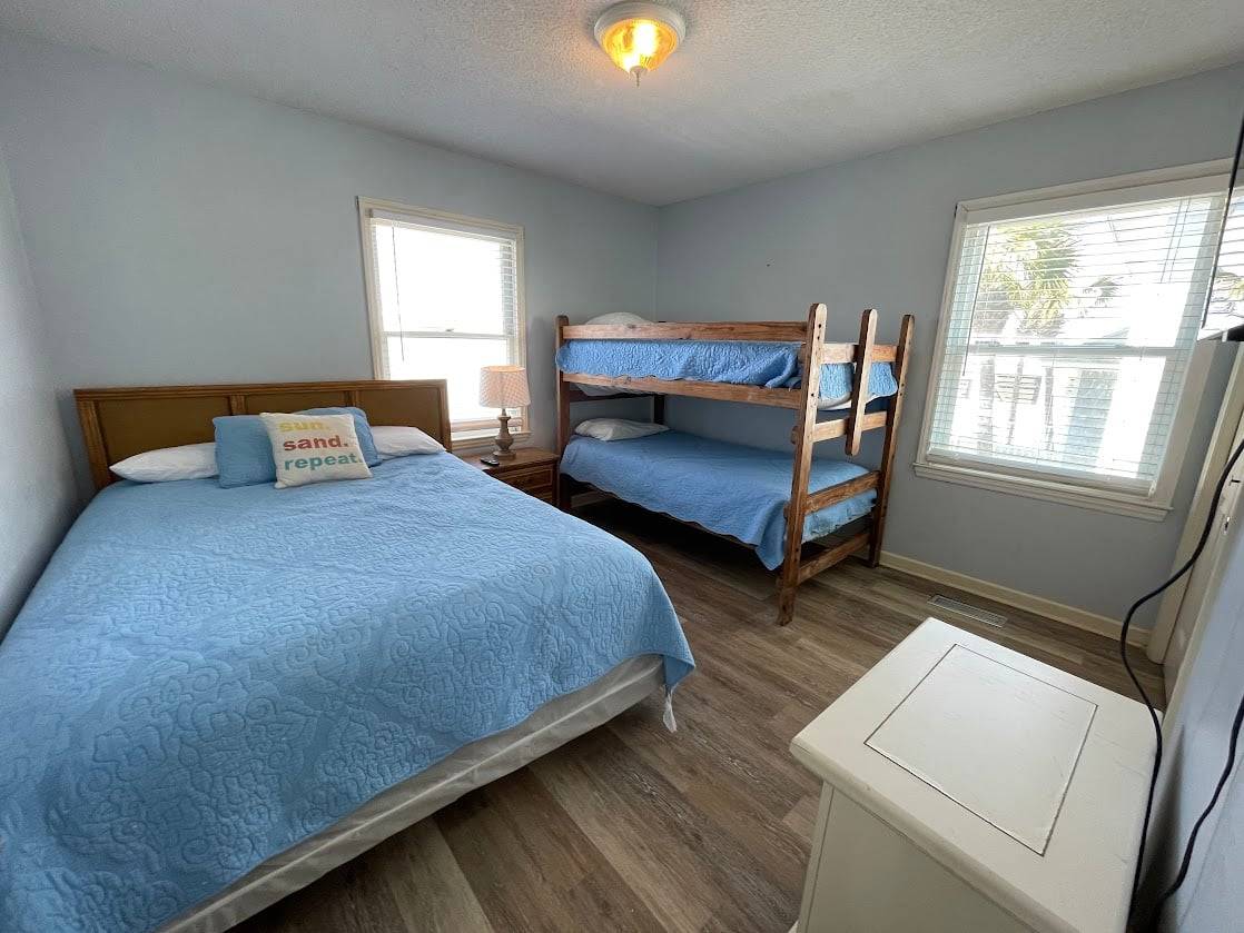 Bedroom 1 down street side - queen, set of bunks Bedroom 1 down street side - queen, set of bunks