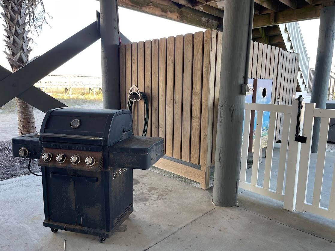Enclosed outside shower, corn hole and propane grill Enclosed outside shower, corn hole and propane grill