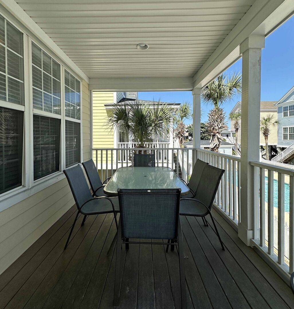 Outside Dining Overlooking Community Pool Outside Dining Overlooking Community Pool