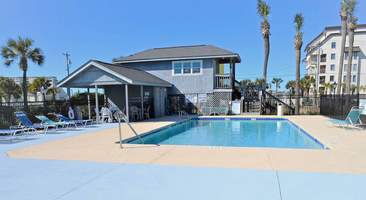 Laundry Facility & Covered Seating Area Overlooking Pool Laundry Facility & Covered Seating Area Overlooking Pool