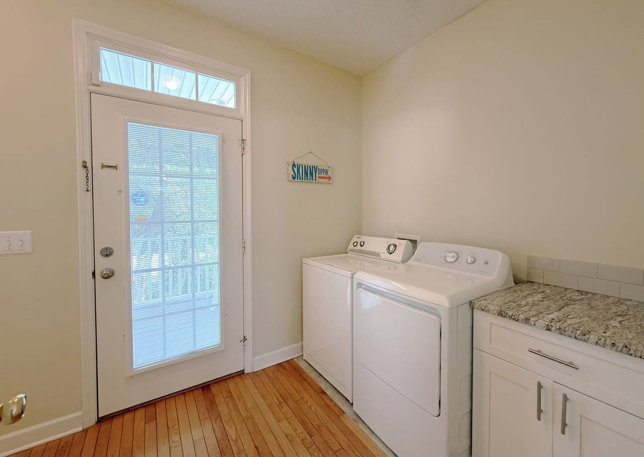 Laundry off the kitchen & access to the back porch. Laundry off the kitchen & access to the back porch.