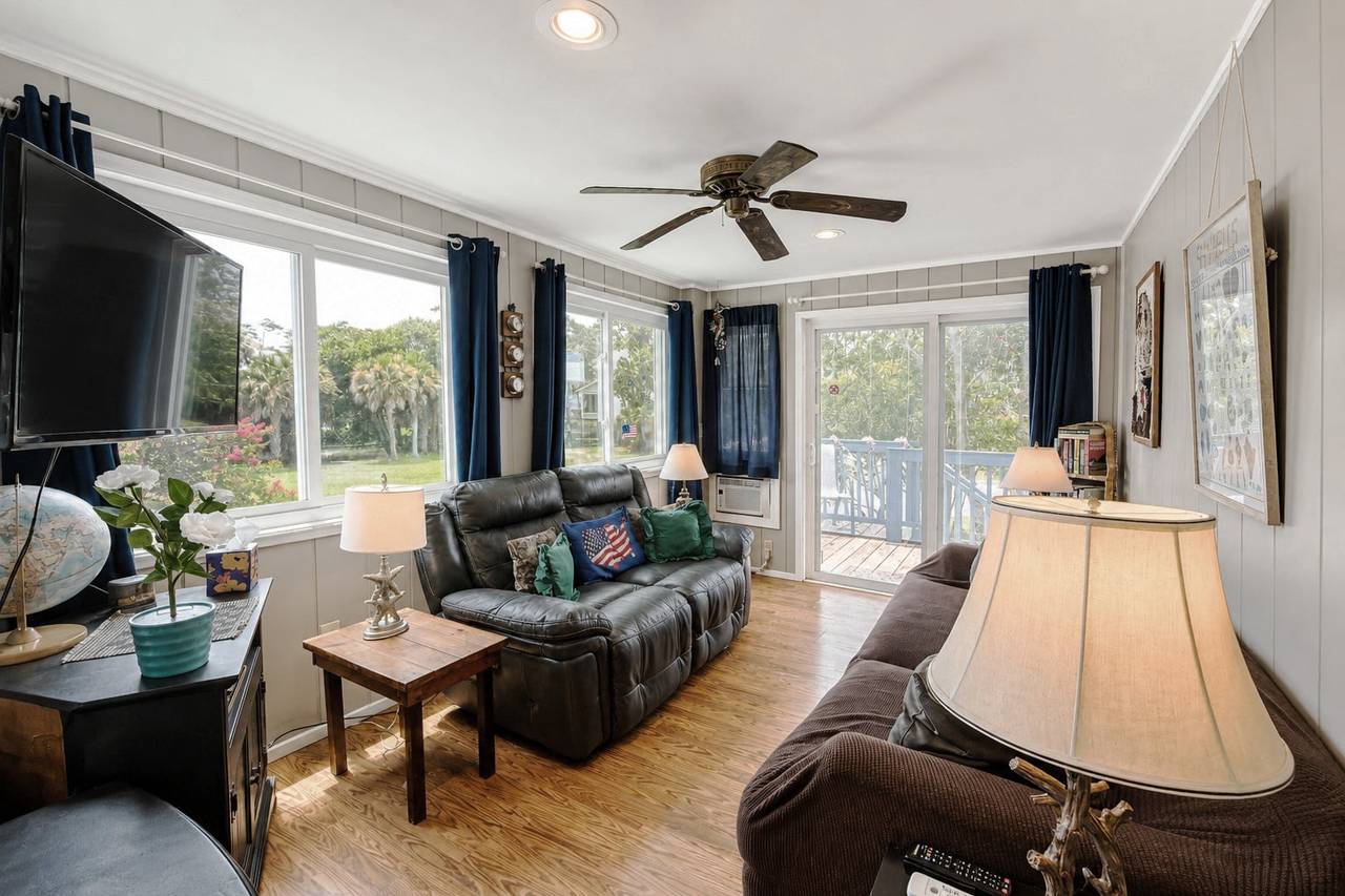 Den off the living room (back porch access). Den off the living room (back porch access).