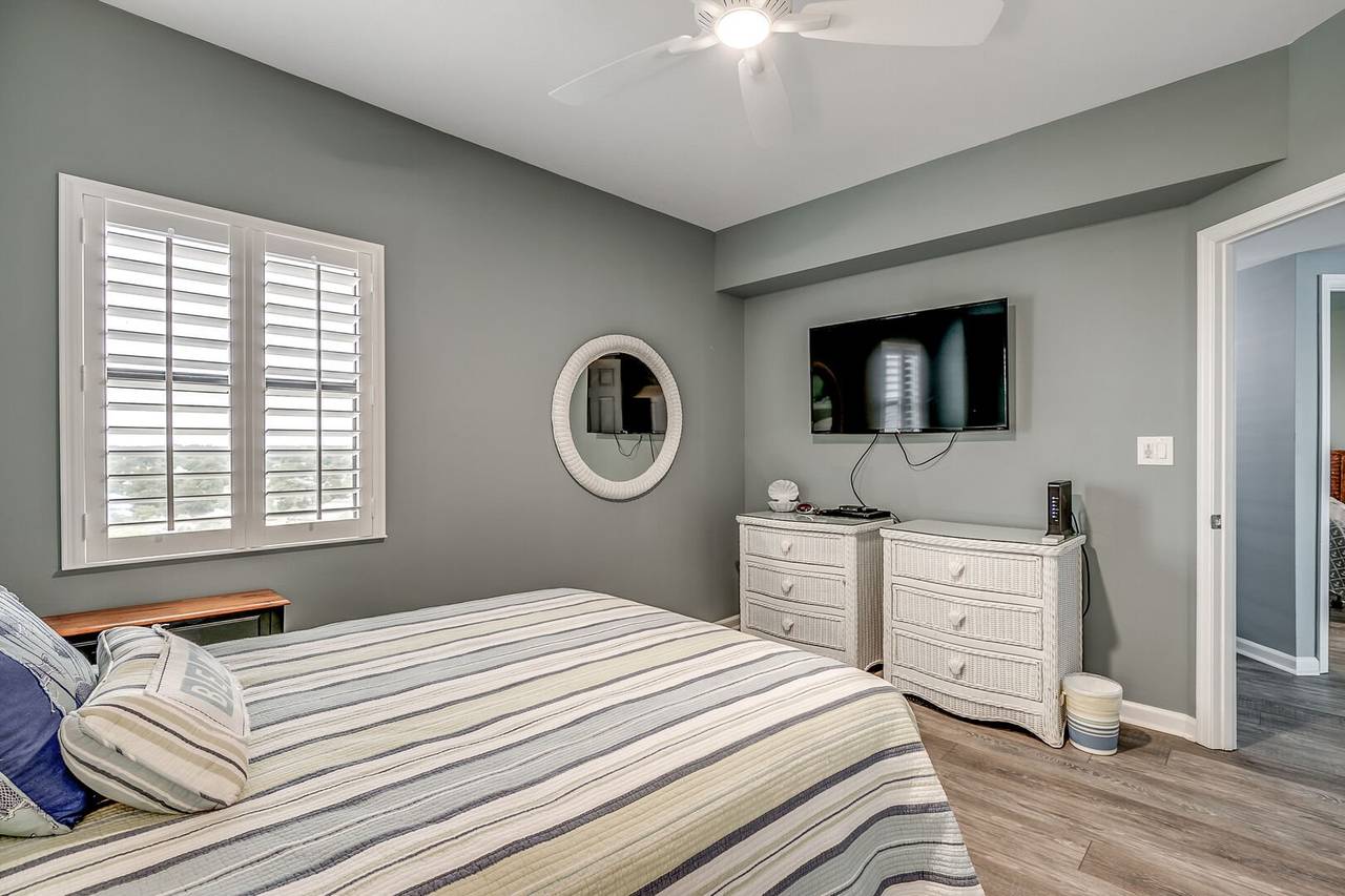 Bedroom 2 with Plantation Shutters & 49” Flat Screen Smart TV Bedroom 2 with Plantation Shutters & 49” Flat Screen Smart TV
