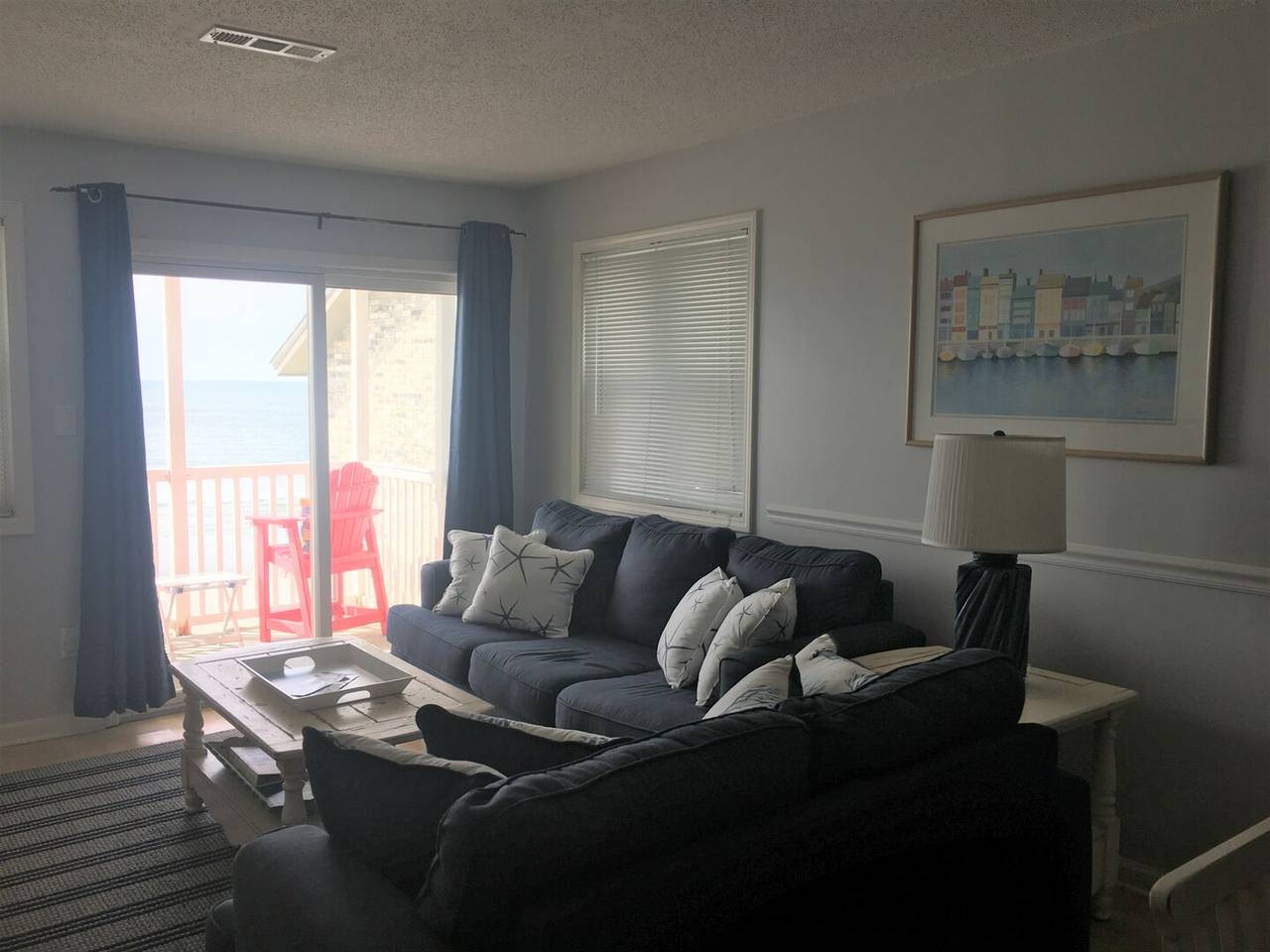 Living Room with Balcony Access and Sleeper Sofa Living Room with Balcony Access and Sleeper Sofa