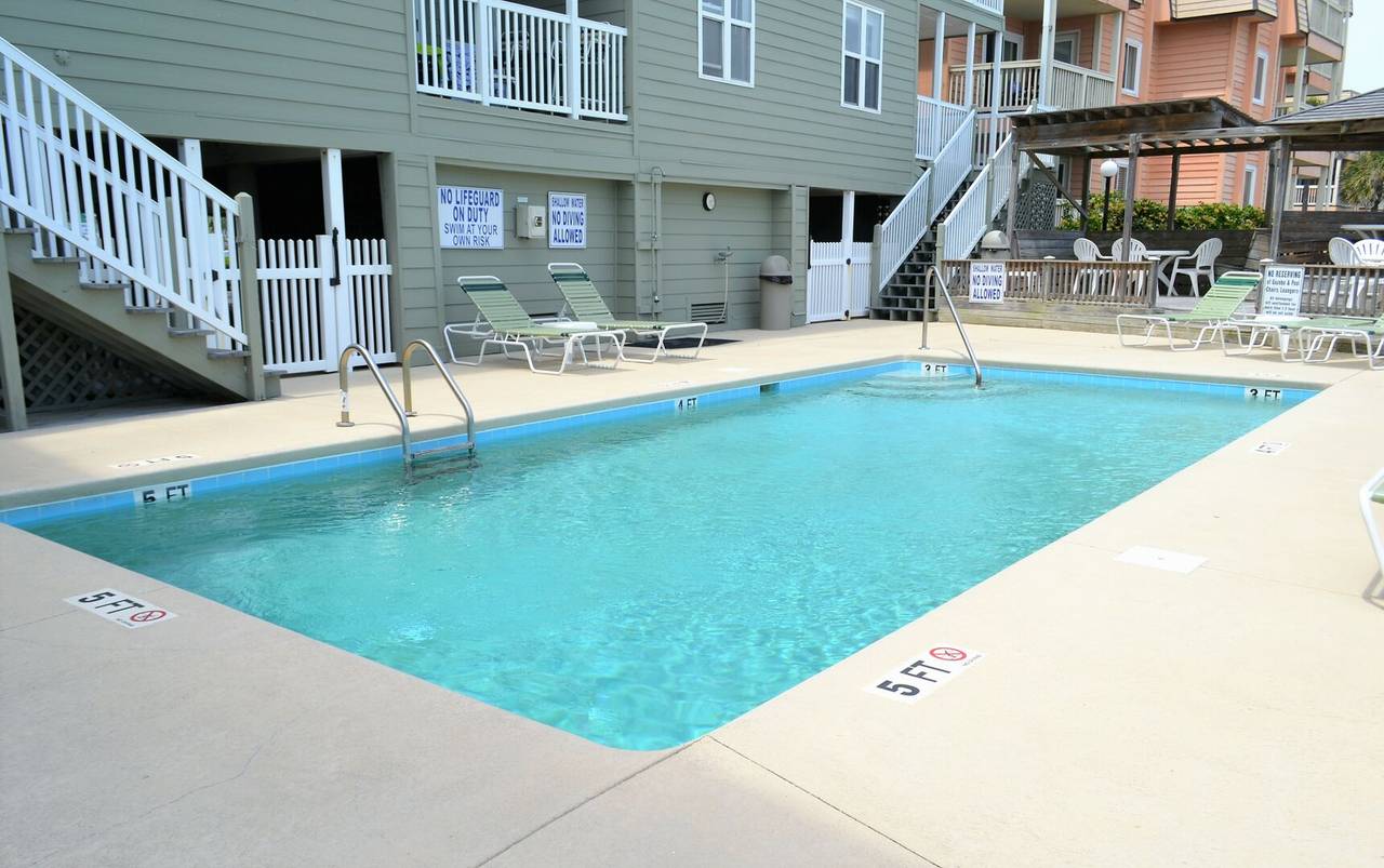 Captain's Walk I amenities include an outside shower, shaded seating, and walkway to beach. Captain's Walk I amenities include an outside shower, shaded seating, and walkway to beach.