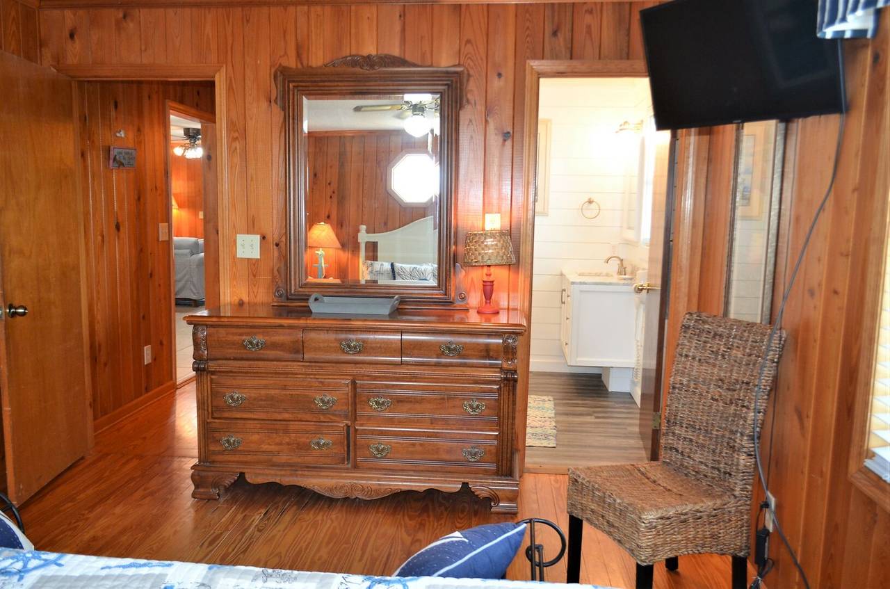 Bedroom 1 has a flat screen TV & private bath. Bedroom 1 has a flat screen TV & private bath.