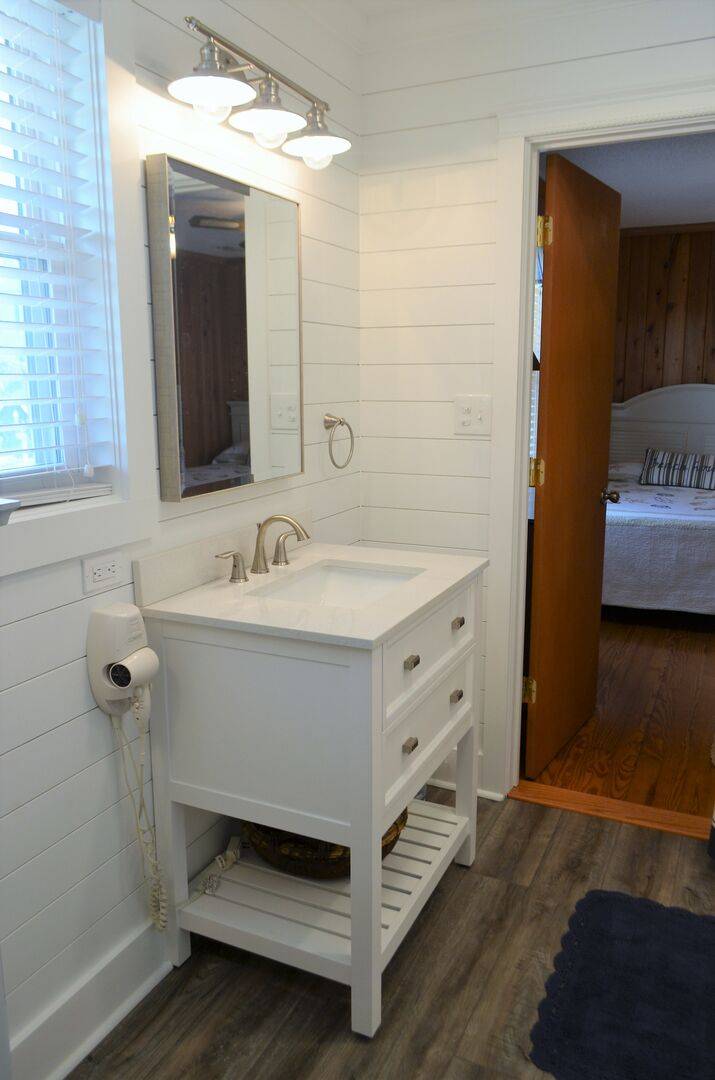 features a single vanity and features a single vanity and