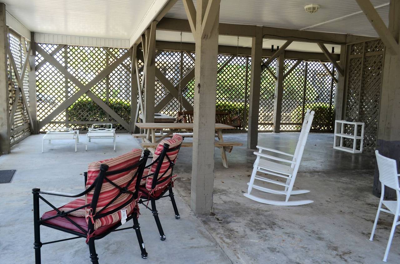 Shaded sitting area underneath home Shaded sitting area underneath home