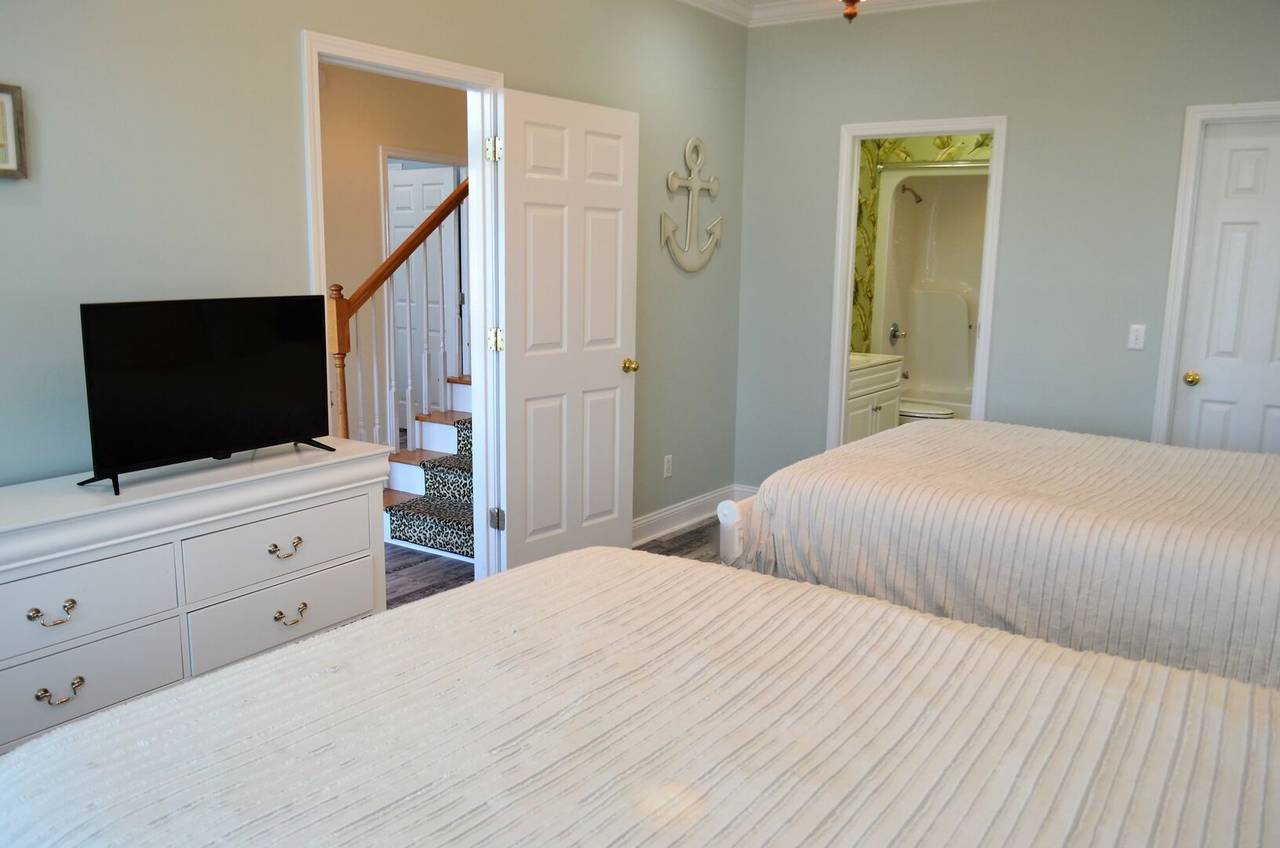 Bedroom 2 has a private bathroom with a shower/tub combo. Bedroom 2 has a private bathroom with a shower/tub combo.