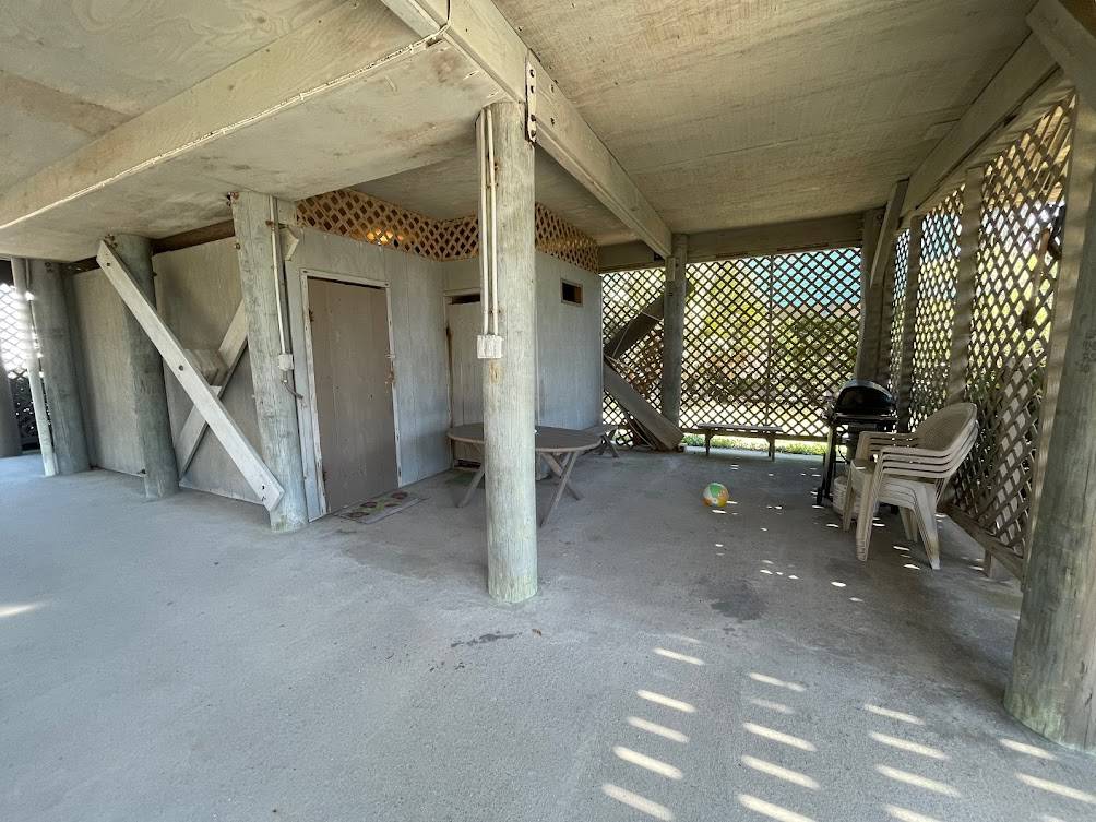 Under house area that includes an enclosed shower Under house area that includes an enclosed shower