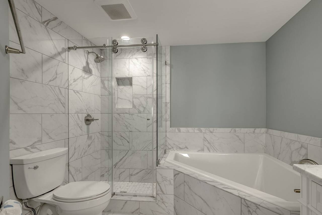 Bedroom 3 Bathroom with Garden Tub & Walk-In Shower Bedroom 3 Bathroom with Garden Tub & Walk-In Shower