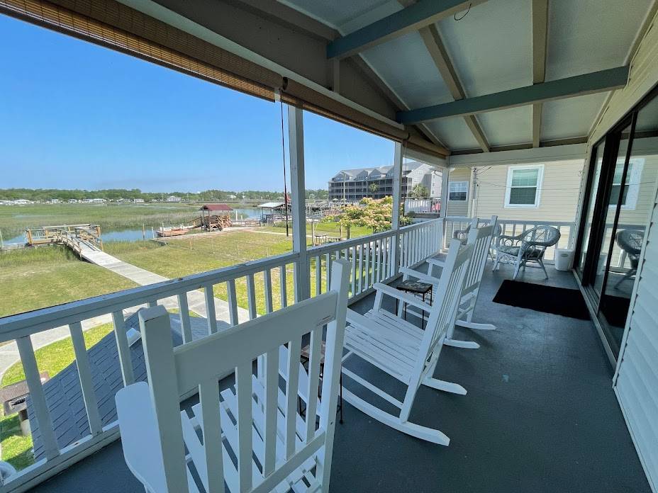 Screen porch with inlet view Screen porch with inlet view