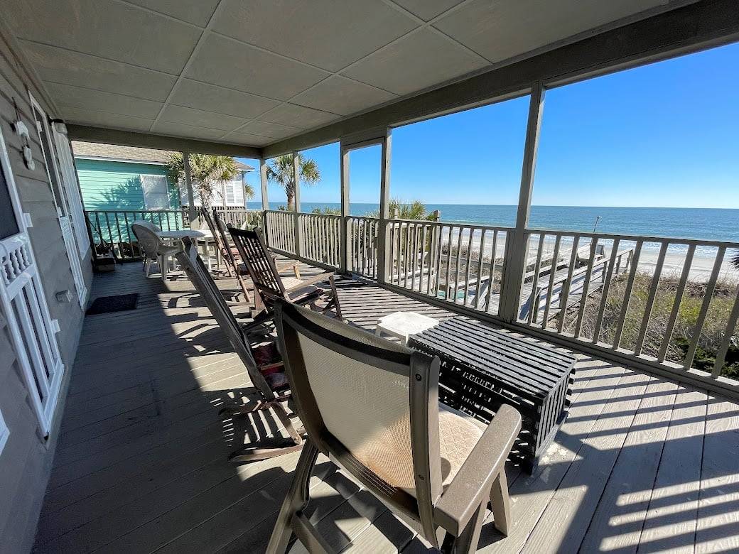 Covered porch with an amazing ocean front view. Covered porch with an amazing ocean front view.