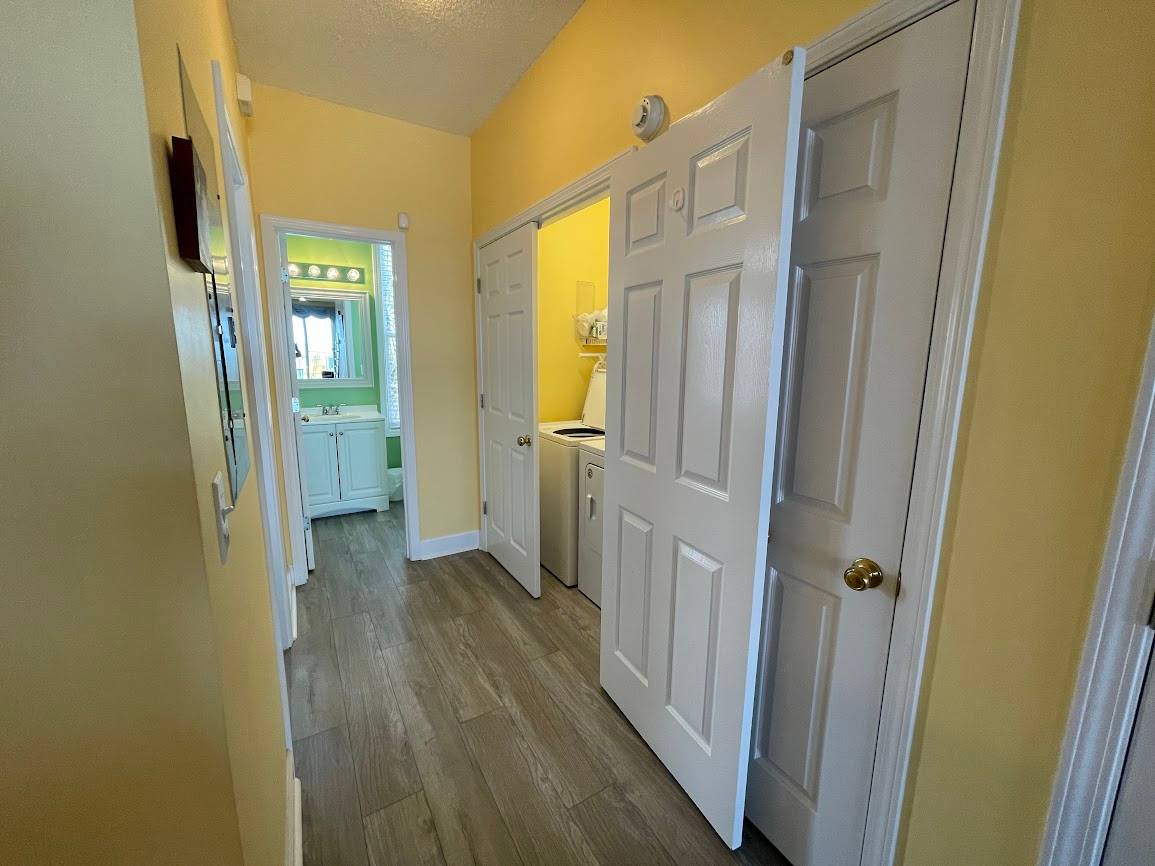 Entry hall to Bedroom 1, Laundry and Bath 1 Entry hall to Bedroom 1, Laundry and Bath 1
