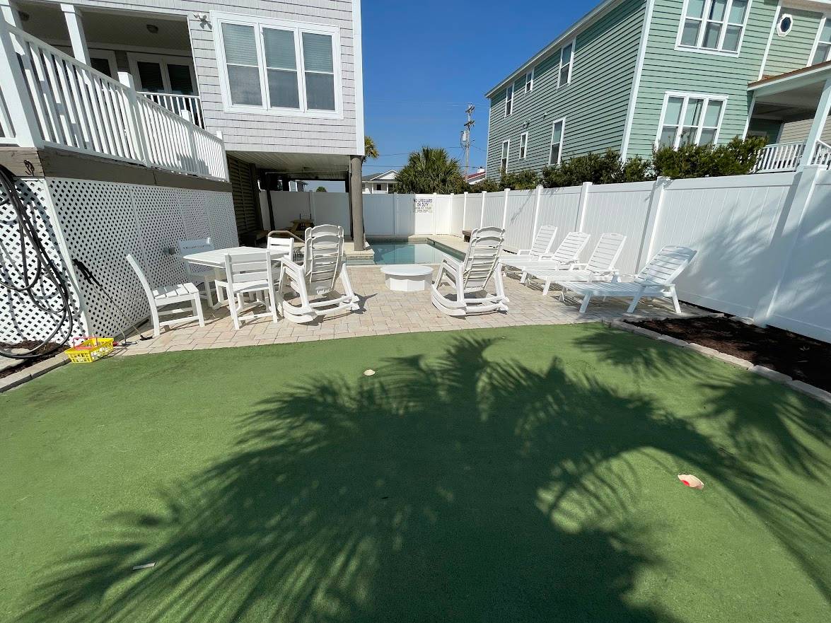 Relax around the pool or putting green Relax around the pool or putting green