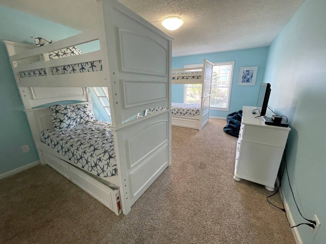 Bedroom 4 down - 2 Sets of Bunks and 2 Single Trundles Bedroom 4 down - 2 Sets of Bunks and 2 Single Trundles