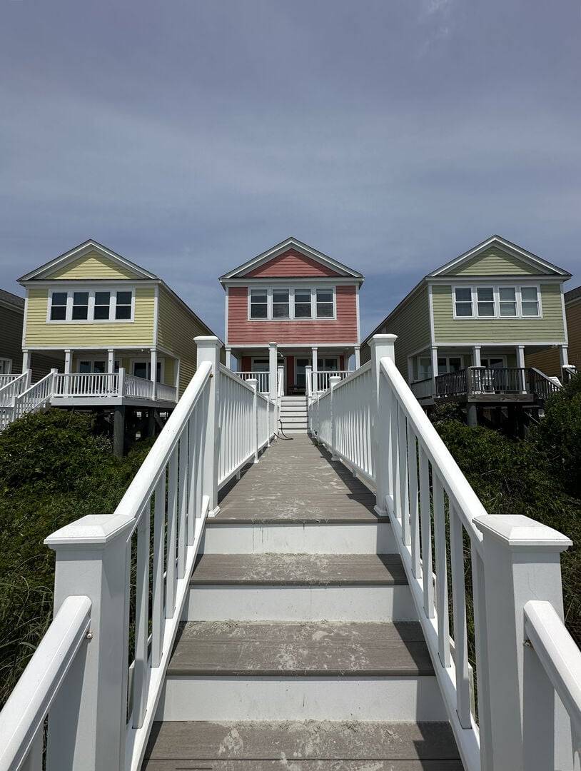 Walkway features an outdoor shower & rinse hose. Walkway features an outdoor shower & rinse hose.