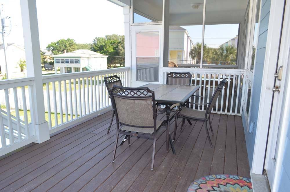 Covered porch overlooking the pool. Covered porch overlooking the pool.