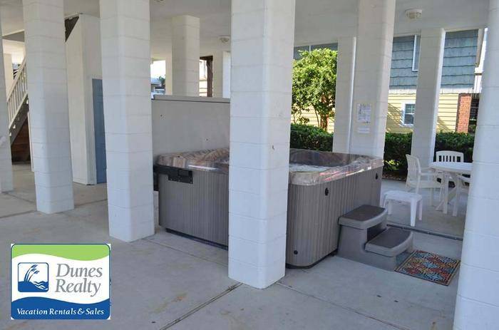 View of hot tub and sitting area View of hot tub and sitting area