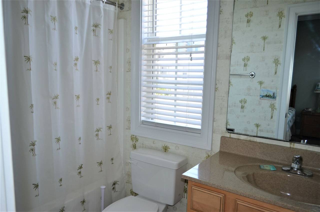 featuring a shower/tub combo featuring a shower/tub combo