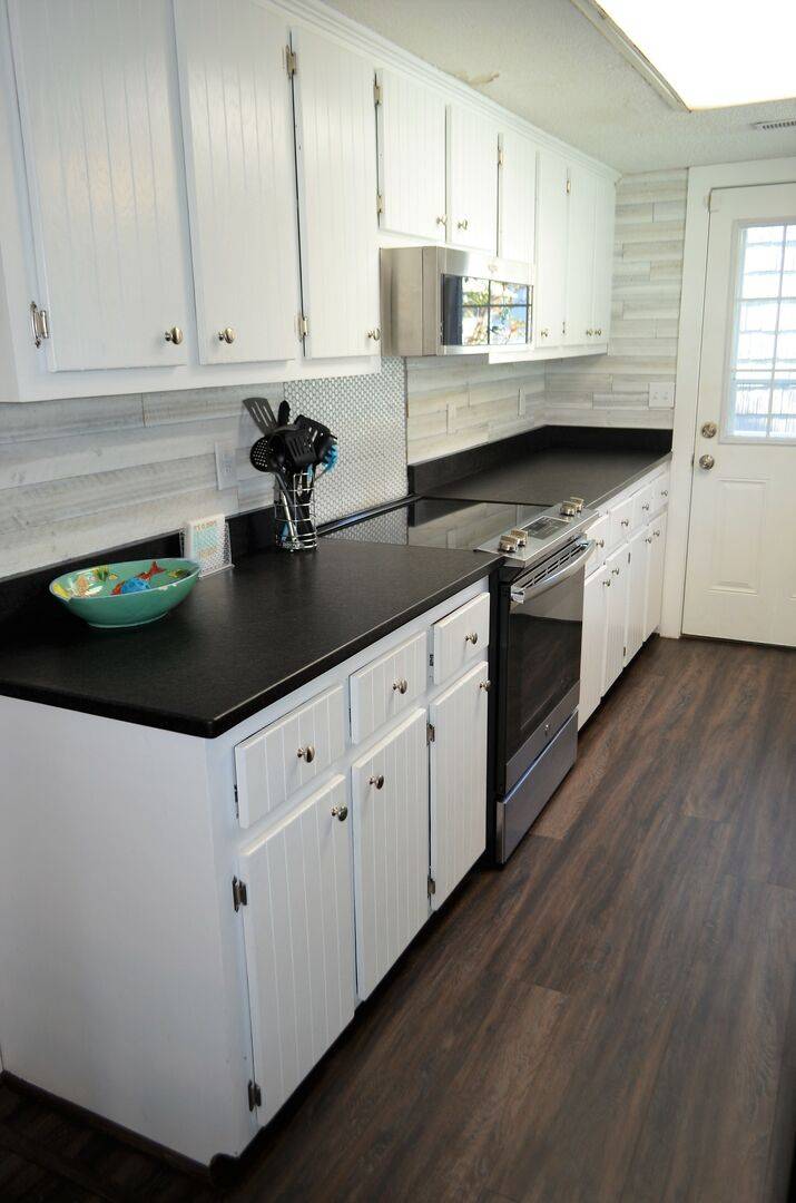 with dishes, cookware, & utensils. with dishes, cookware, & utensils.