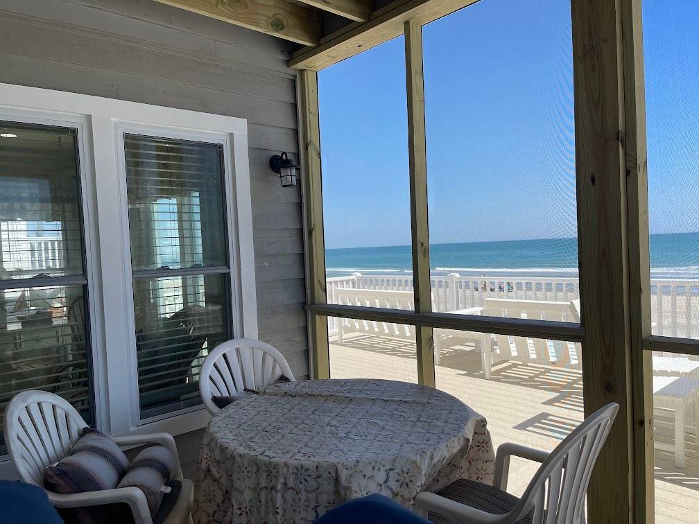 Screen porch accessed from kitchen Screen porch accessed from kitchen