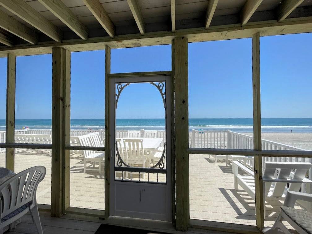 Screen porch accessed from kitchen Screen porch accessed from kitchen
