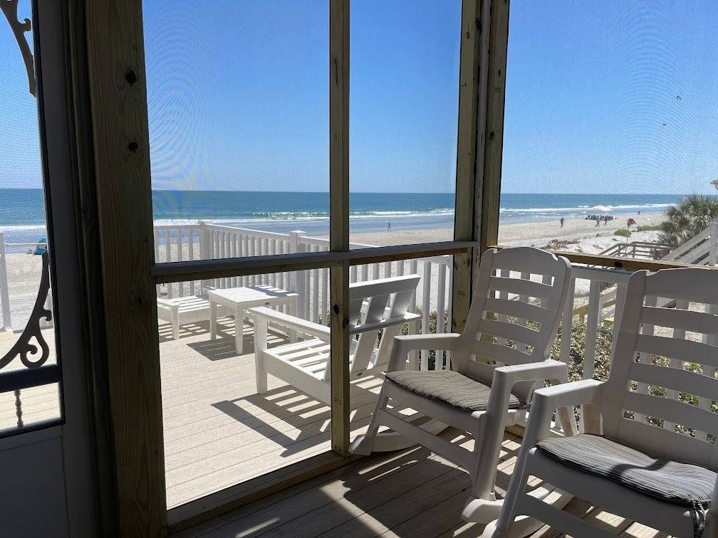 Screen porch accessed from kitchen Screen porch accessed from kitchen