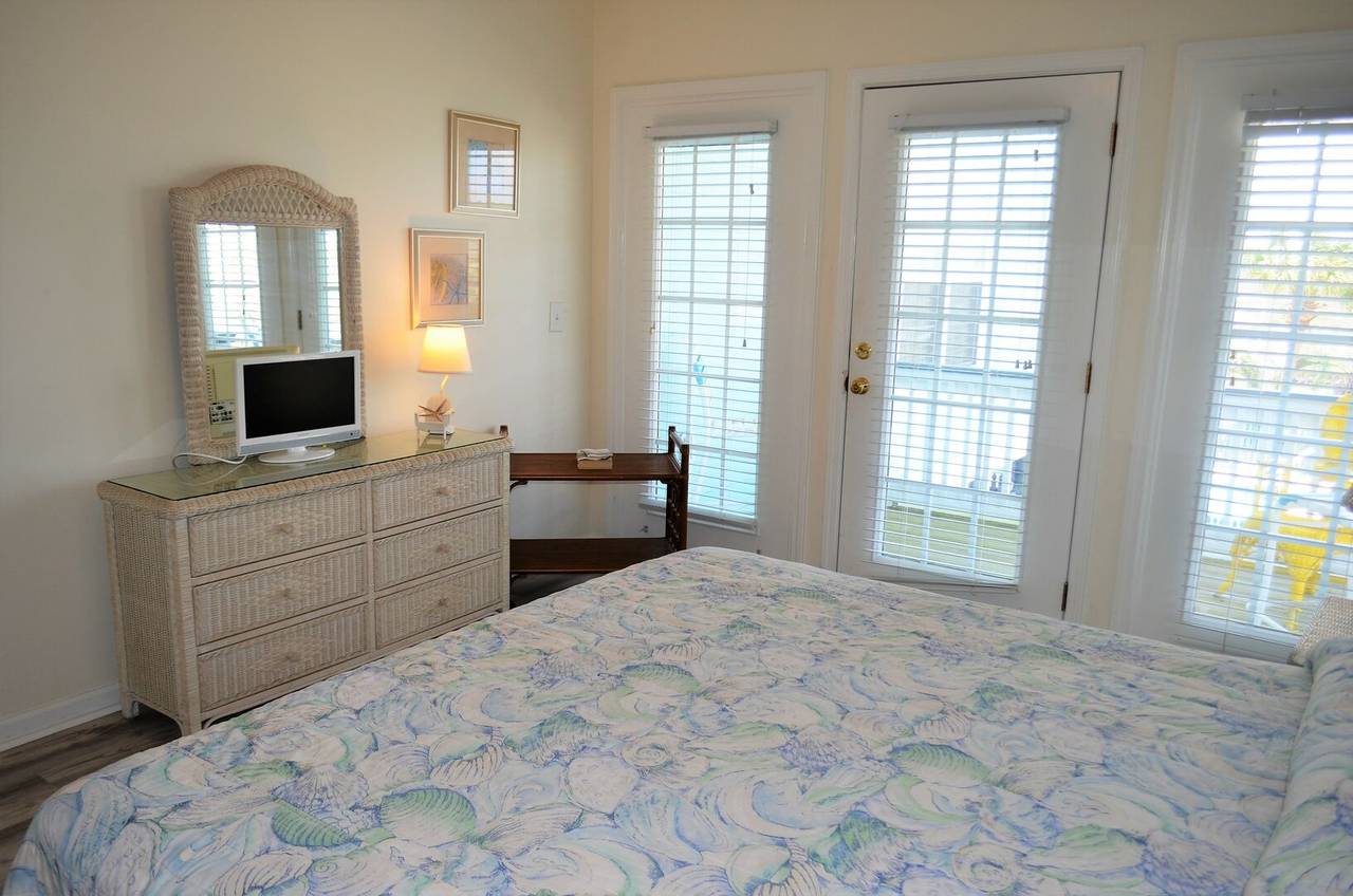 Bedroom 1 TV and private porch access Bedroom 1 TV and private porch access