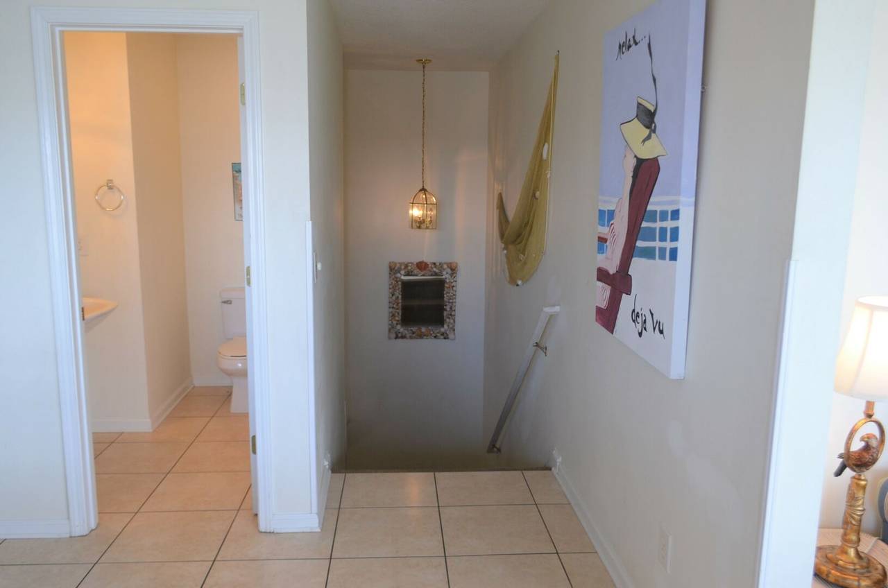 Half bath off kitchen and stairway Half bath off kitchen and stairway