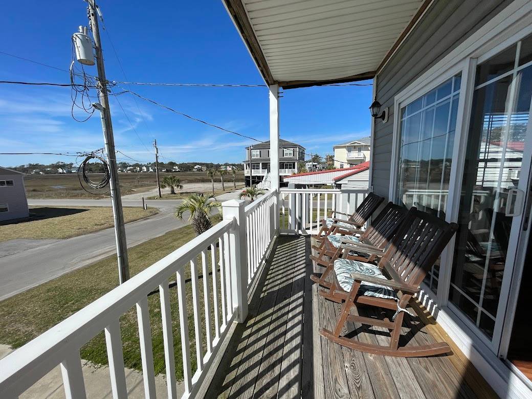 View to the marsh from the upstairs covered porch. View to the marsh from the upstairs covered porch.