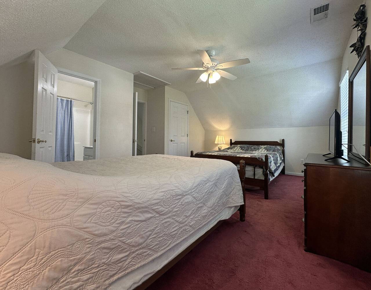 Bedroom 2 has a private bathroom. Bedroom 2 has a private bathroom.