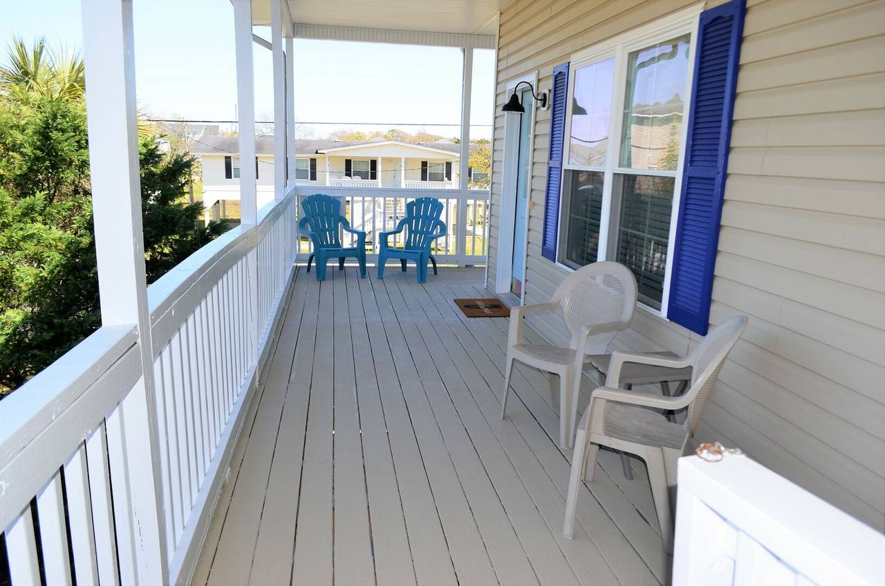 Enjoy outdoor relaxation on the large covered porch. Enjoy outdoor relaxation on the large covered porch.