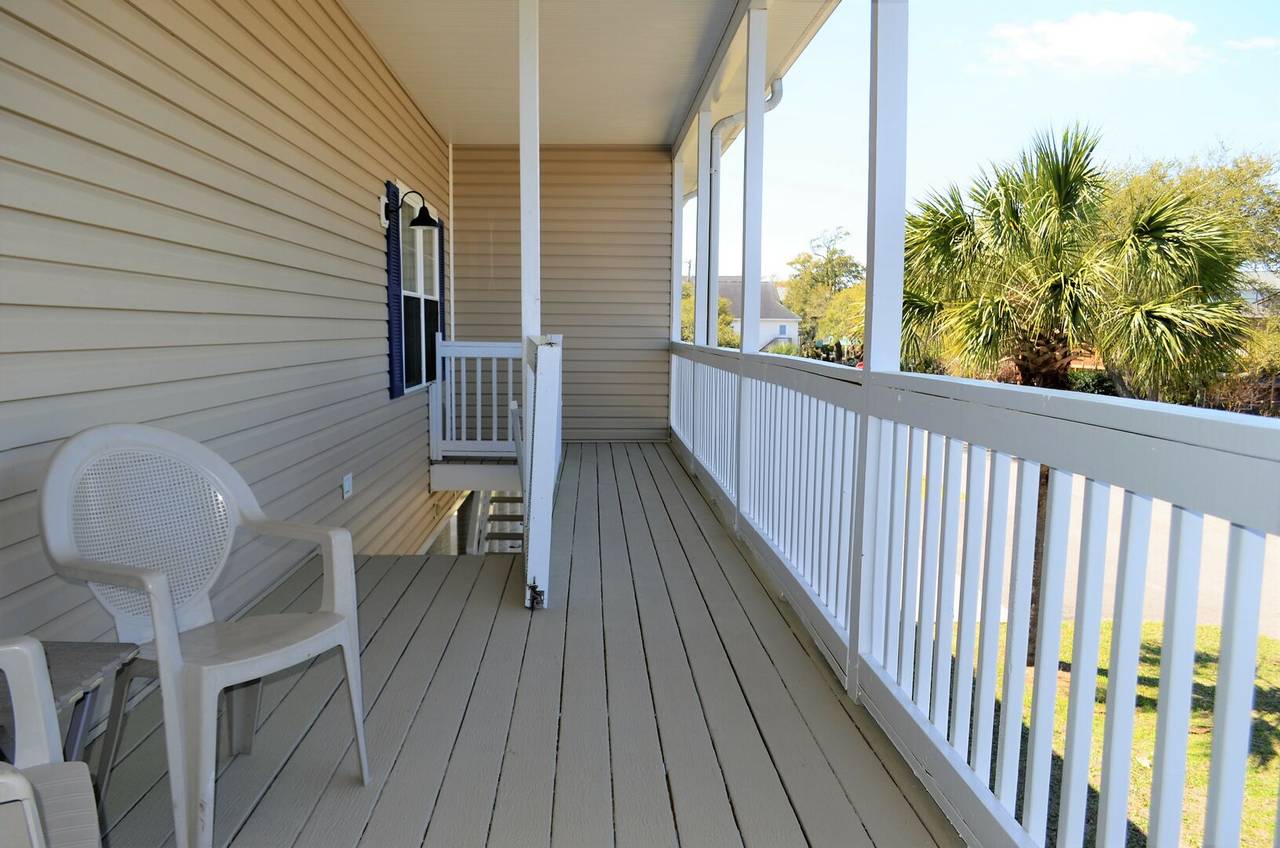 The porch features a gate to close off the stairway. The porch features a gate to close off the stairway.