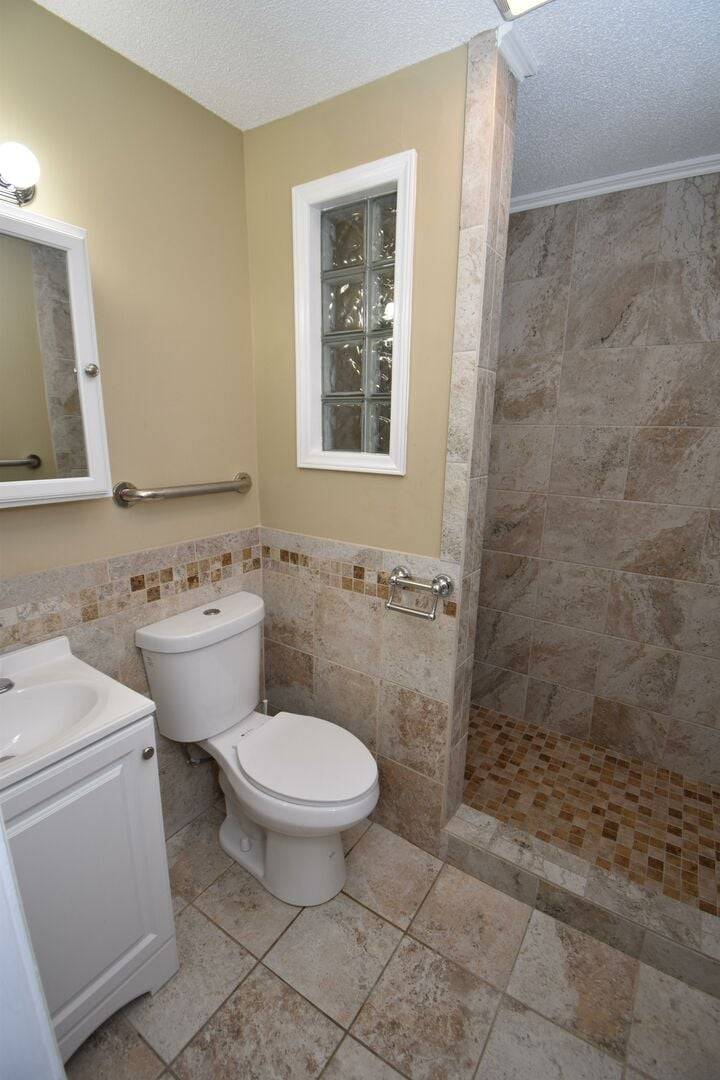 Private bath with tile walk in shower Private bath with tile walk in shower