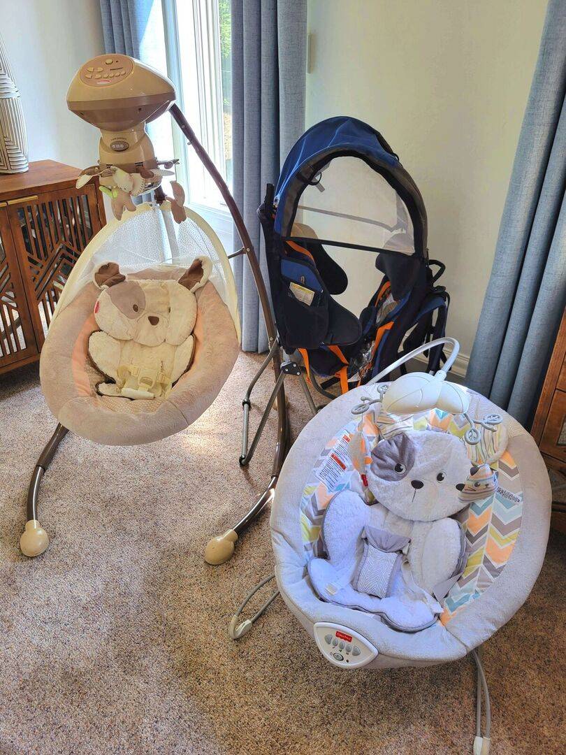 Swing, bouncer, and 2 hiking backpacks Swing, bouncer, and 2 hiking backpacks