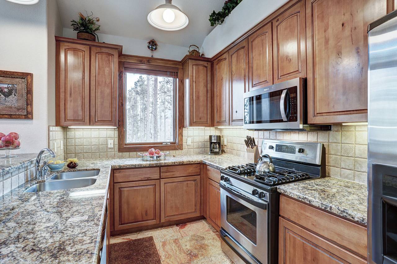 This spacious kitchen boasts updated stainless steel appliances and granite countertops - Amber Sky Breckenridge Vacation Rental This spacious kitchen boasts updated stainless steel appliances and granite countertops - Amber Sky Breckenridge Vacation Rental