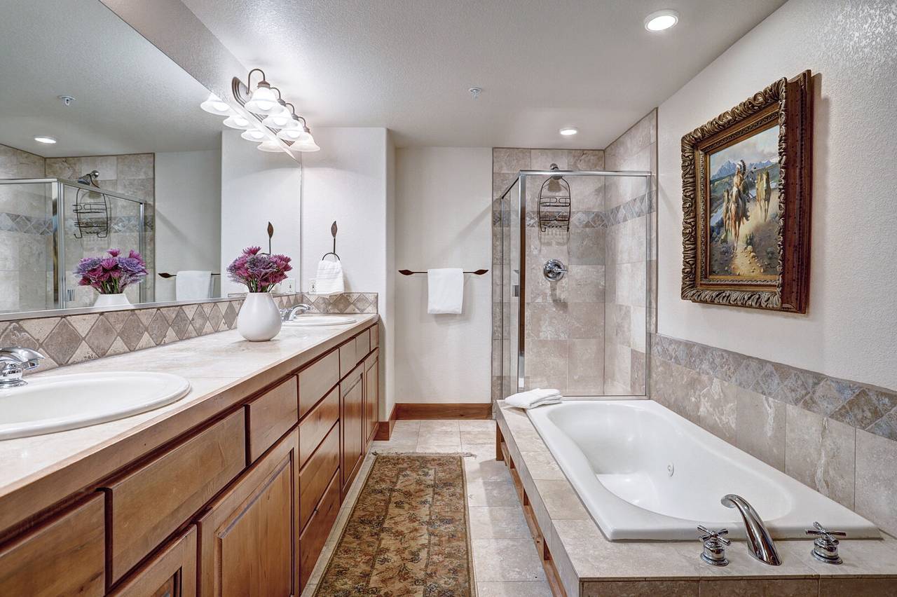 Relax in a bubble bath in this large primary bathroom - Amber Sky Breckenridge Vacation Rental Relax in a bubble bath in this large primary bathroom - Amber Sky Breckenridge Vacation Rental